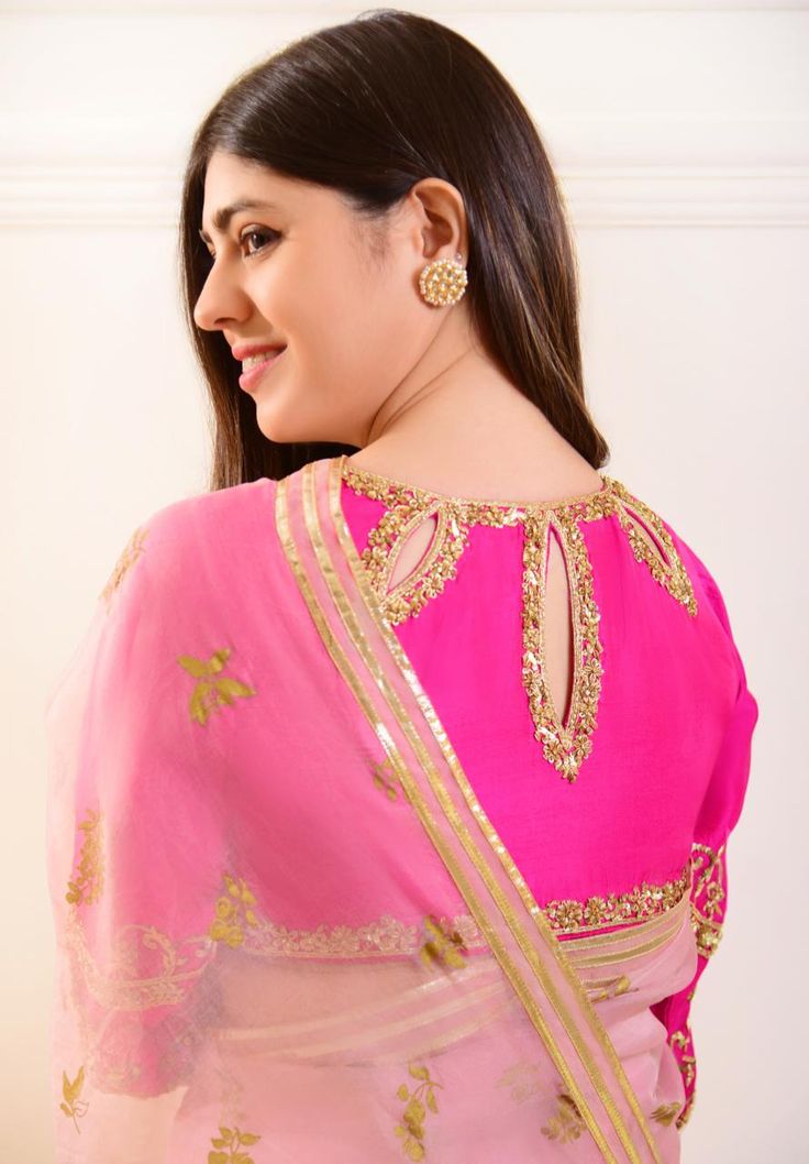 7 yards of pure luxury, indulge in “ Zeb “ adorned on pure organza in a dreamy pastel teapink shade with hand blocked motifs in an gold. The blouse is on pure raw silk 80 gms with intricate gold zardosi, for timeless elegance. The length of the saree blouse is 14 inches.You can mention your customised blouse size at th Elegant Pink Chanderi Saree, Elegant Pink Chanderi Blouse Piece, Elegant Organza Blouse With Zari Work, Elegant Pink Blouse With Sheer Dupatta, Festive Tissue Silk Blouse Piece With Gota Work, Bollywood Silk Blouse With Gota Work, Bollywood Style Raw Silk Blouse With Sheer Dupatta, Anarkali Traditional Wear With Unstitched Organza Blouse, Elegant Pink Saree With Zari Work