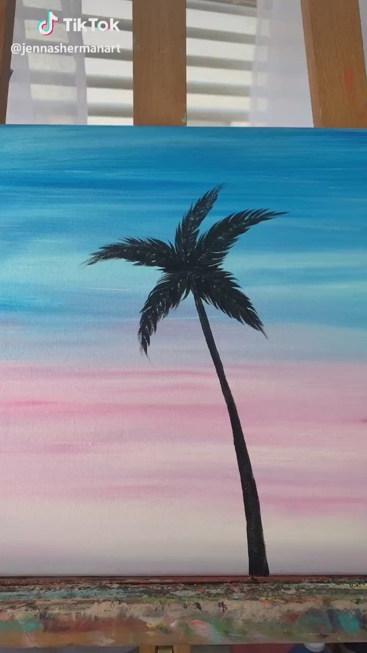 This may contain: a painting of two palm trees in front of a pink and blue sky