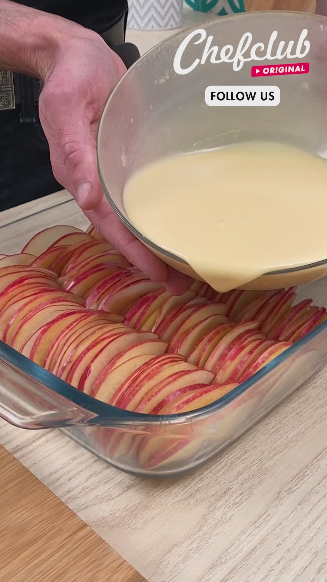 This may contain: apple pie being drizzled with caramel sauce in a glass baking dish