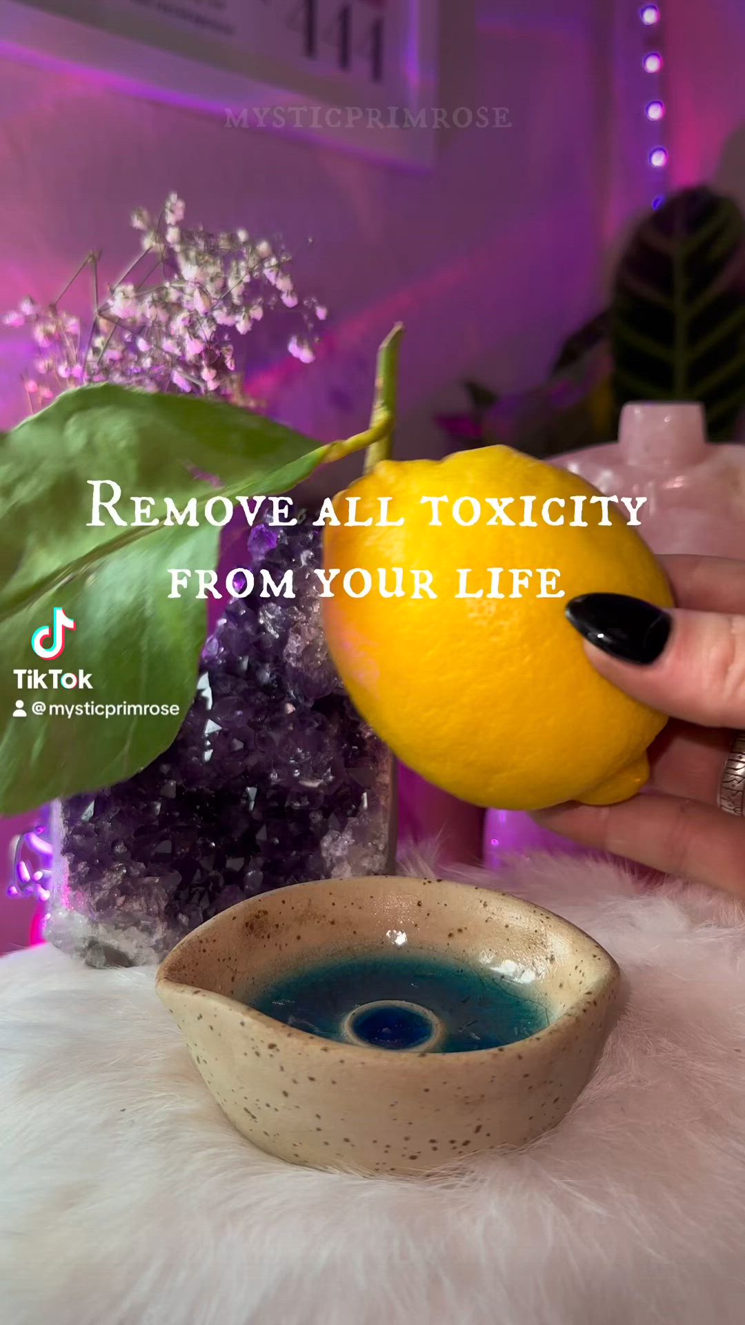 This may contain: a person holding an orange in their hand with the words remove all oxicity from your life