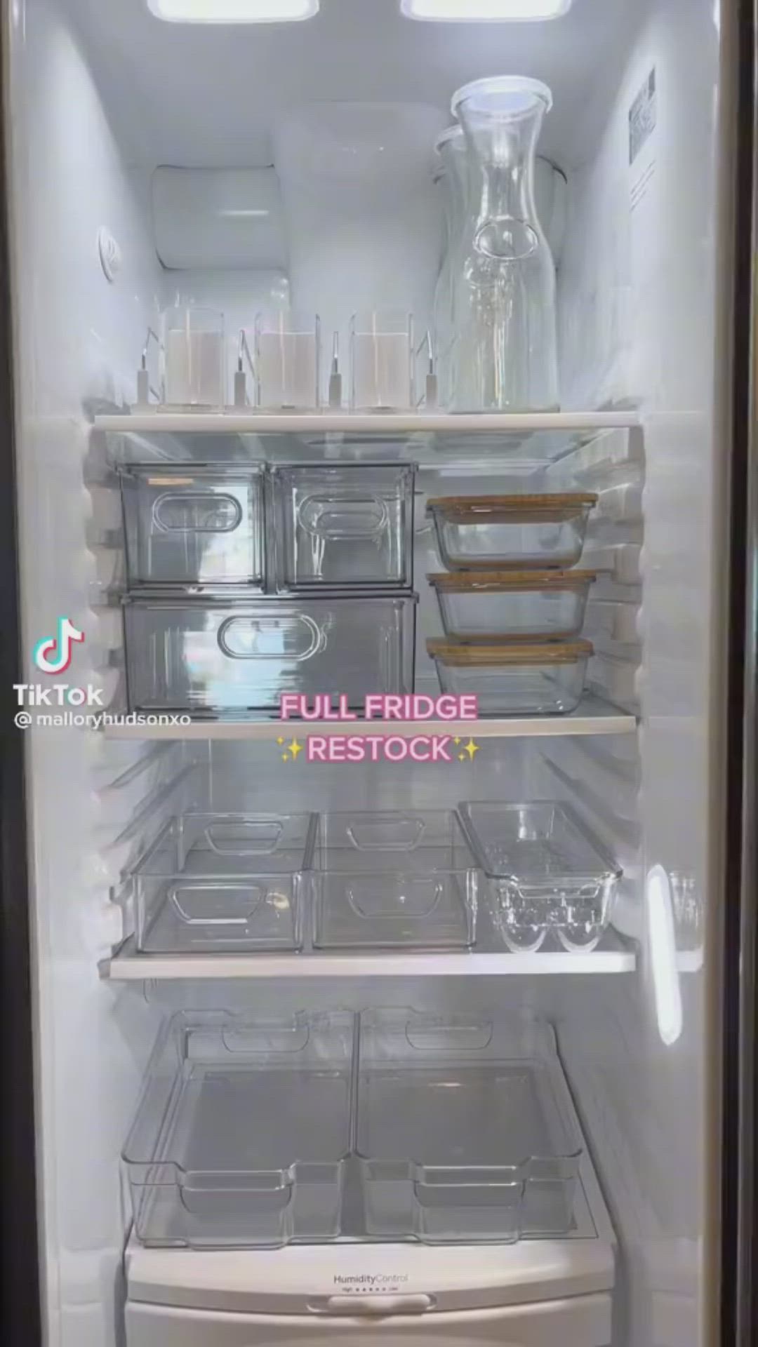 This may contain: an open refrigerator filled with lots of plastic containers