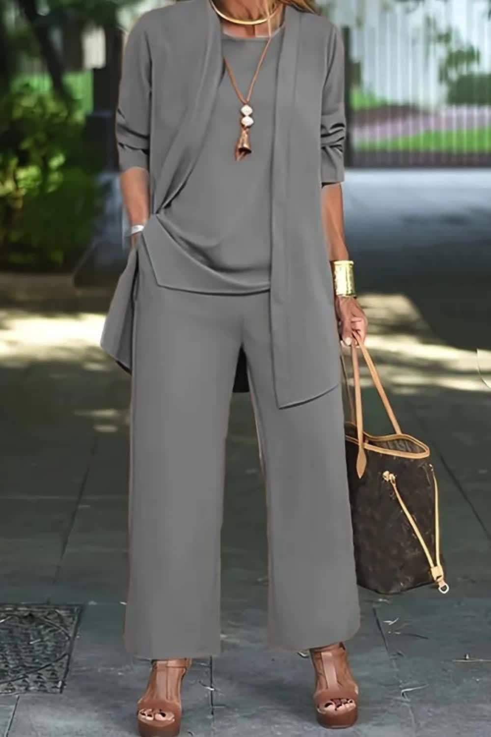 This Casual Three-Piece Solid Set includes a long sleeve cardigan, a matching top, and long pants. Perfect for effortless style, this outfit is comfortable and versatile for everyday wear.