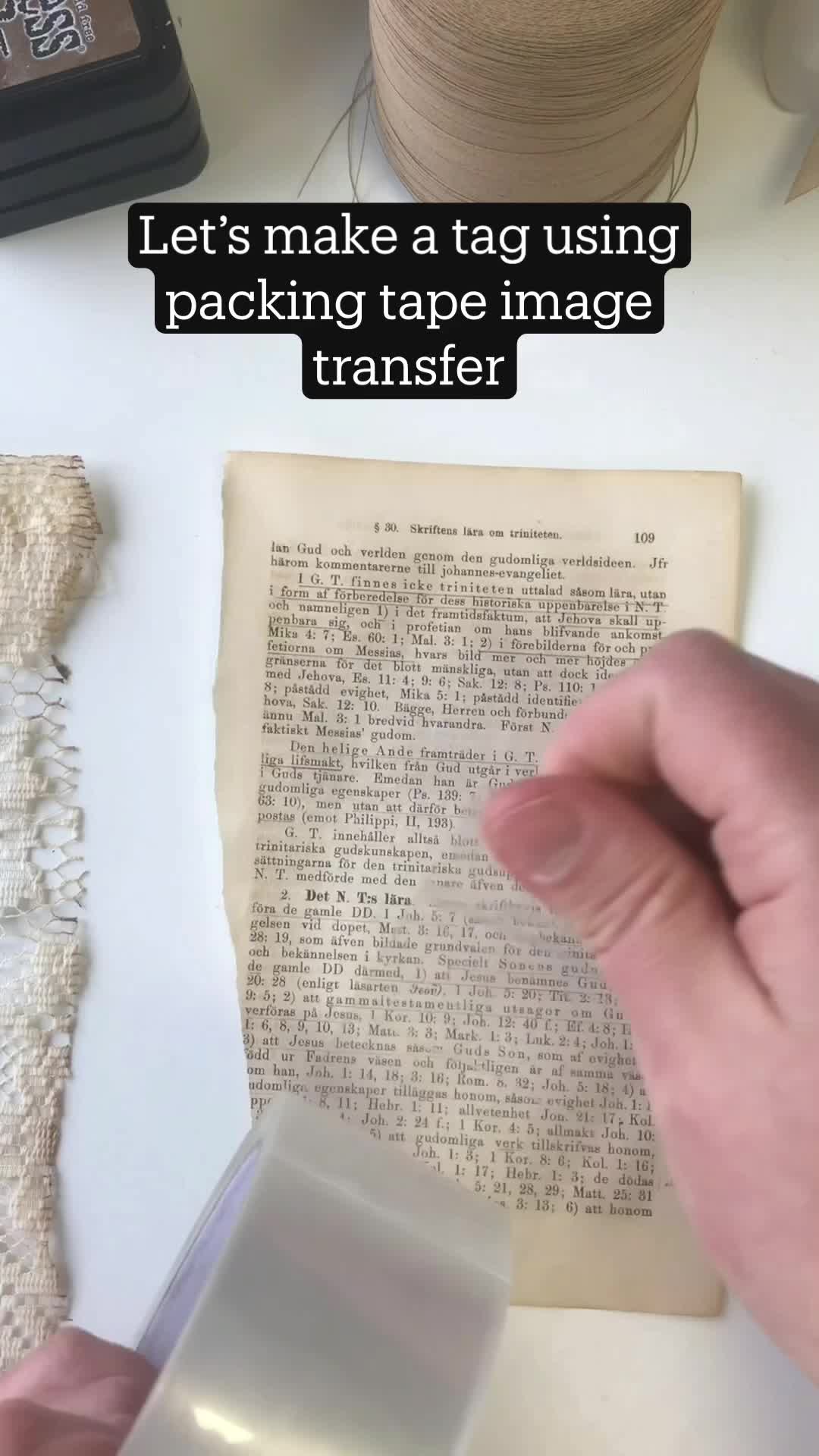 This may contain: someone is using tape to make a book page