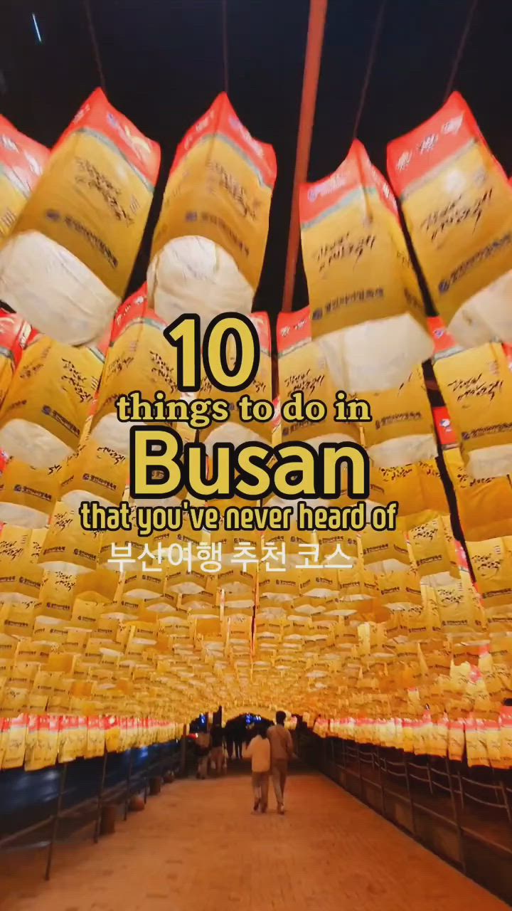 This may contain: there are many bags of food hanging from the ceiling with words on it that read 10 things to do in busan that you've never heard