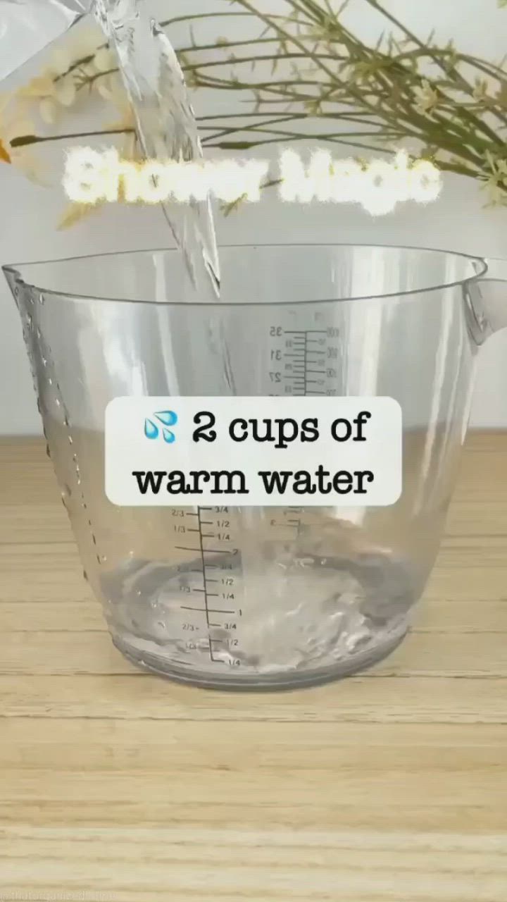 This may contain: two cups of warm water being poured into a measuring cup with the words, 2 cups of warm water