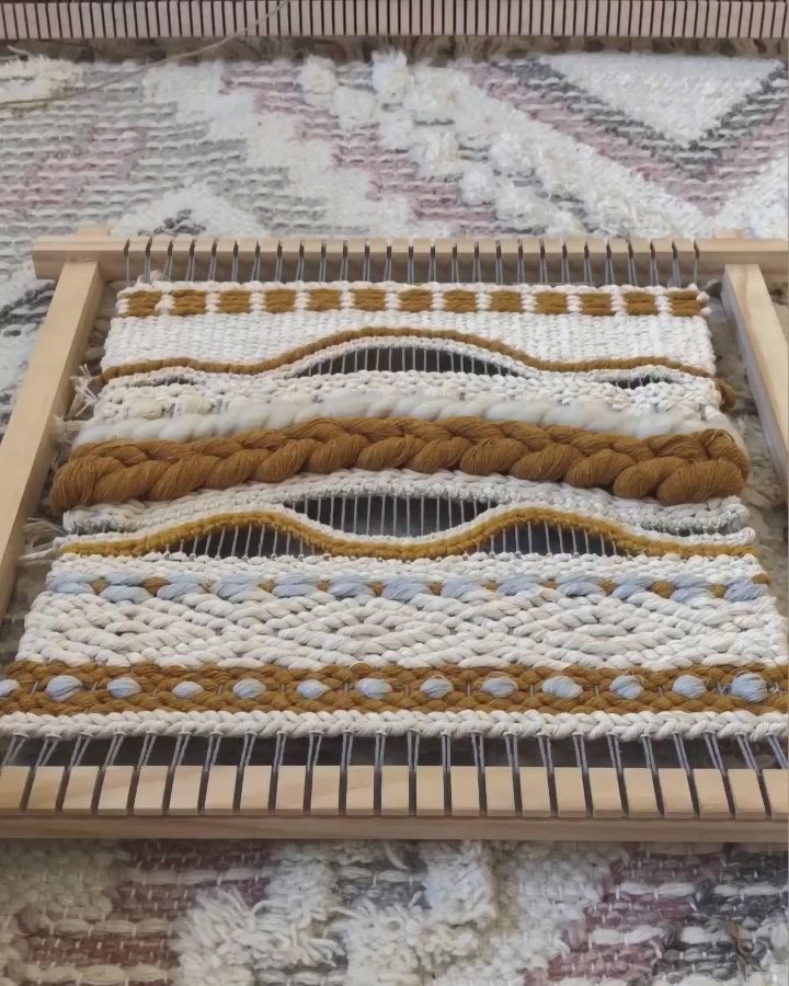 This may contain: a close up of a weaving machine on a rug