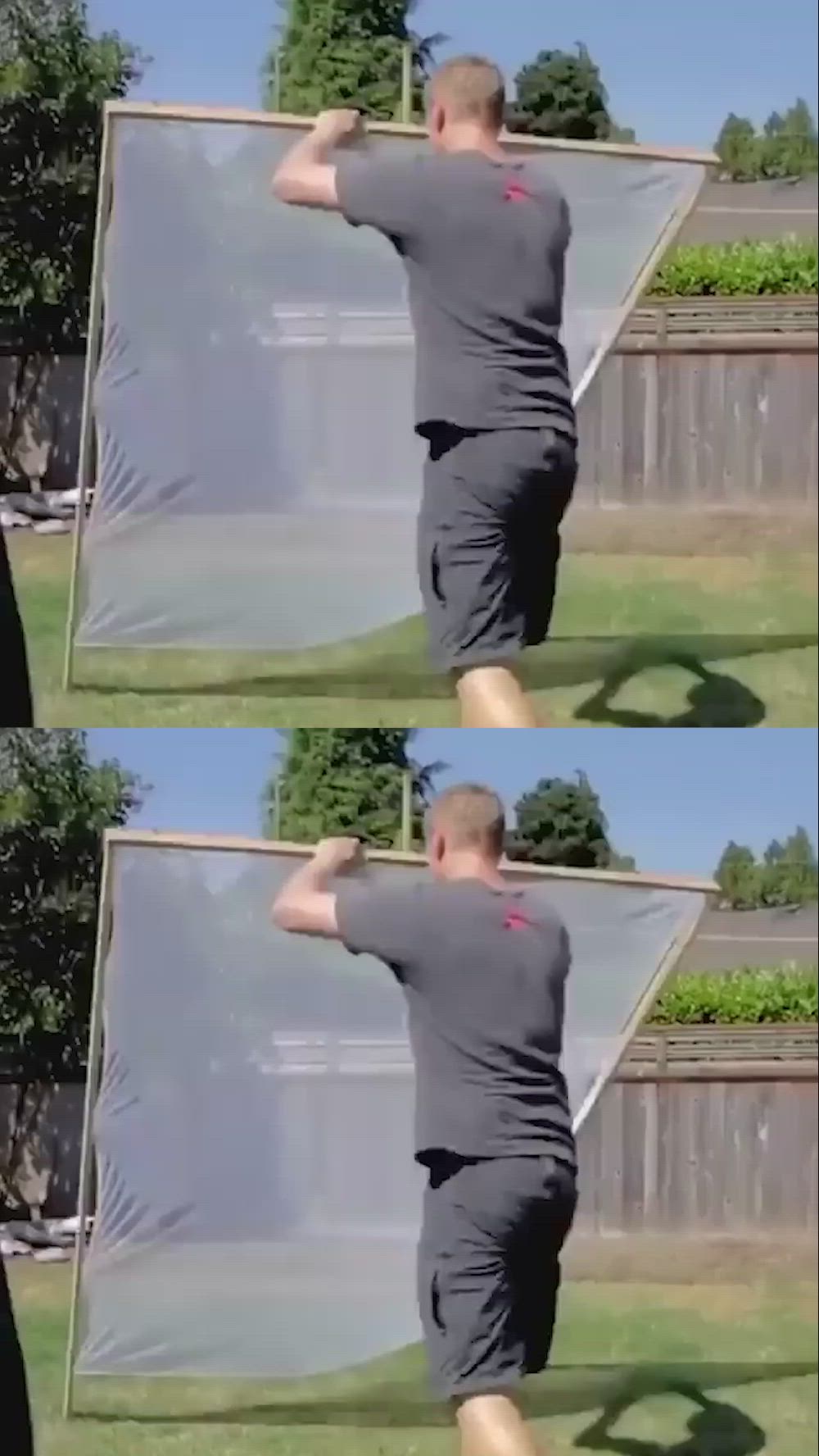 This may contain: the man is practicing his pull ups in front of an open air screen with one hand