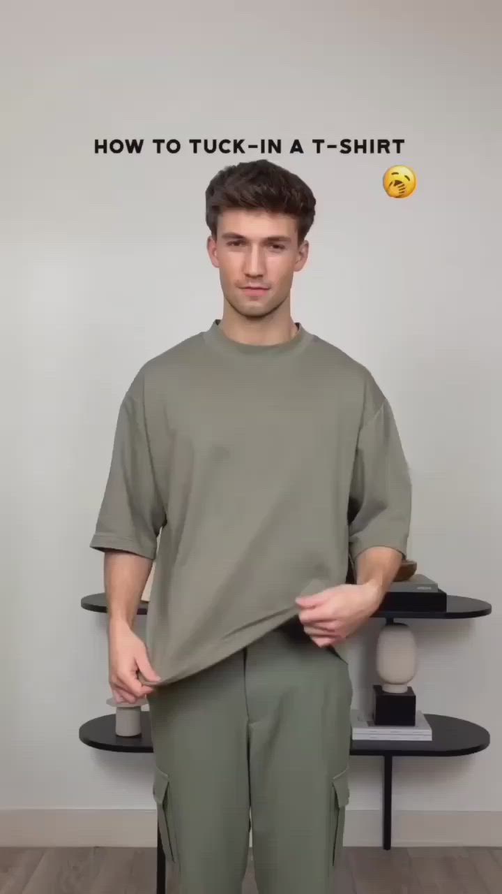 This contains an image of: How tuck your shirt