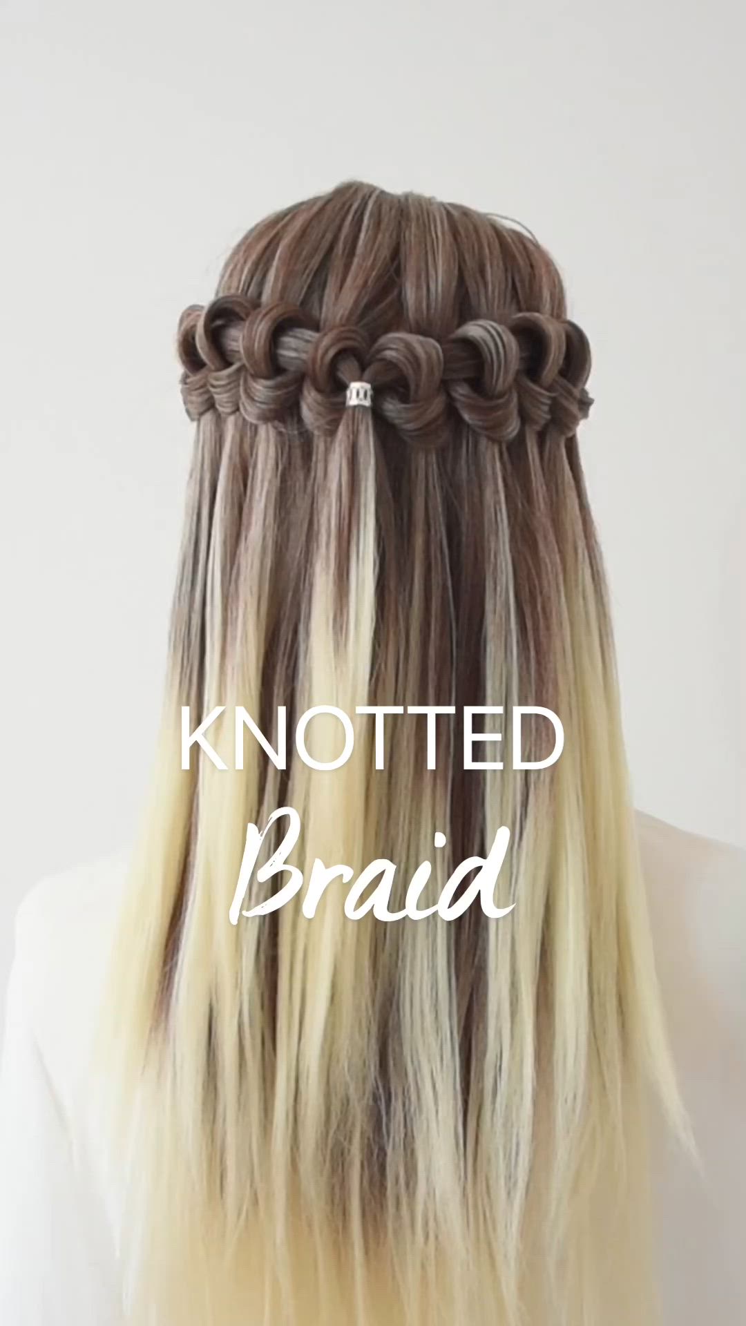 This contains an image of: Try this beautiful knotted #braid style for #backtoschool #waterfallbraid #peinados #hairstyles