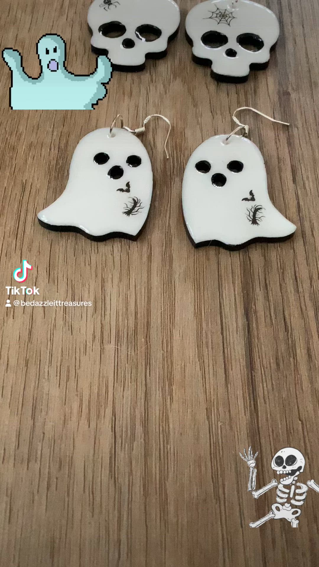 Handmade ghost and skull Halloween earrings made from epoxy in white with black outline