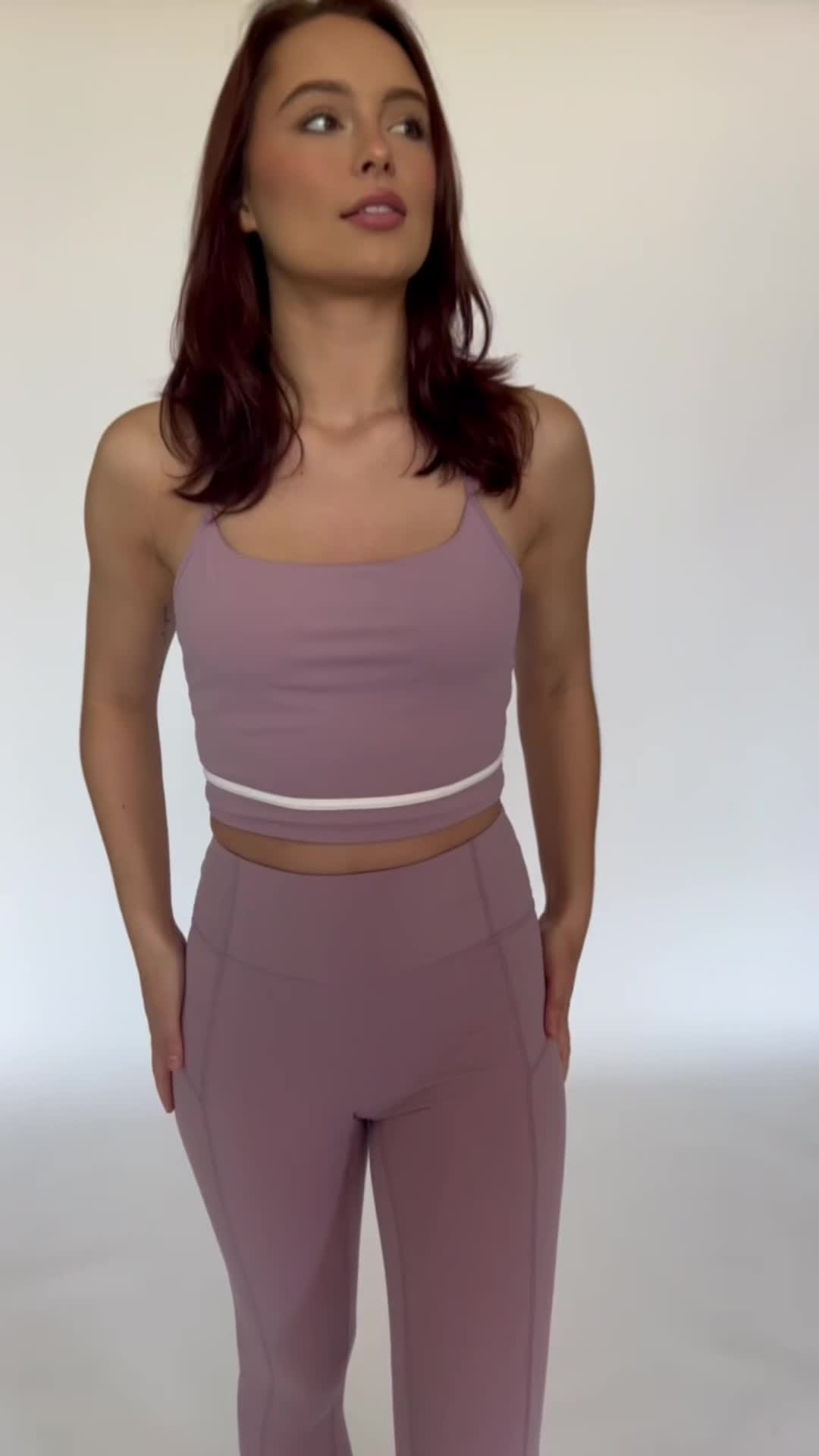 Our Mauve Mist White Line Crop Tank is the perfect addition to your athleisure collection. Featuring a white line detail, sleek Y-Back design, and sweat wicking material, this tank effortlessly takes you from your workout class to brunch with the girls.