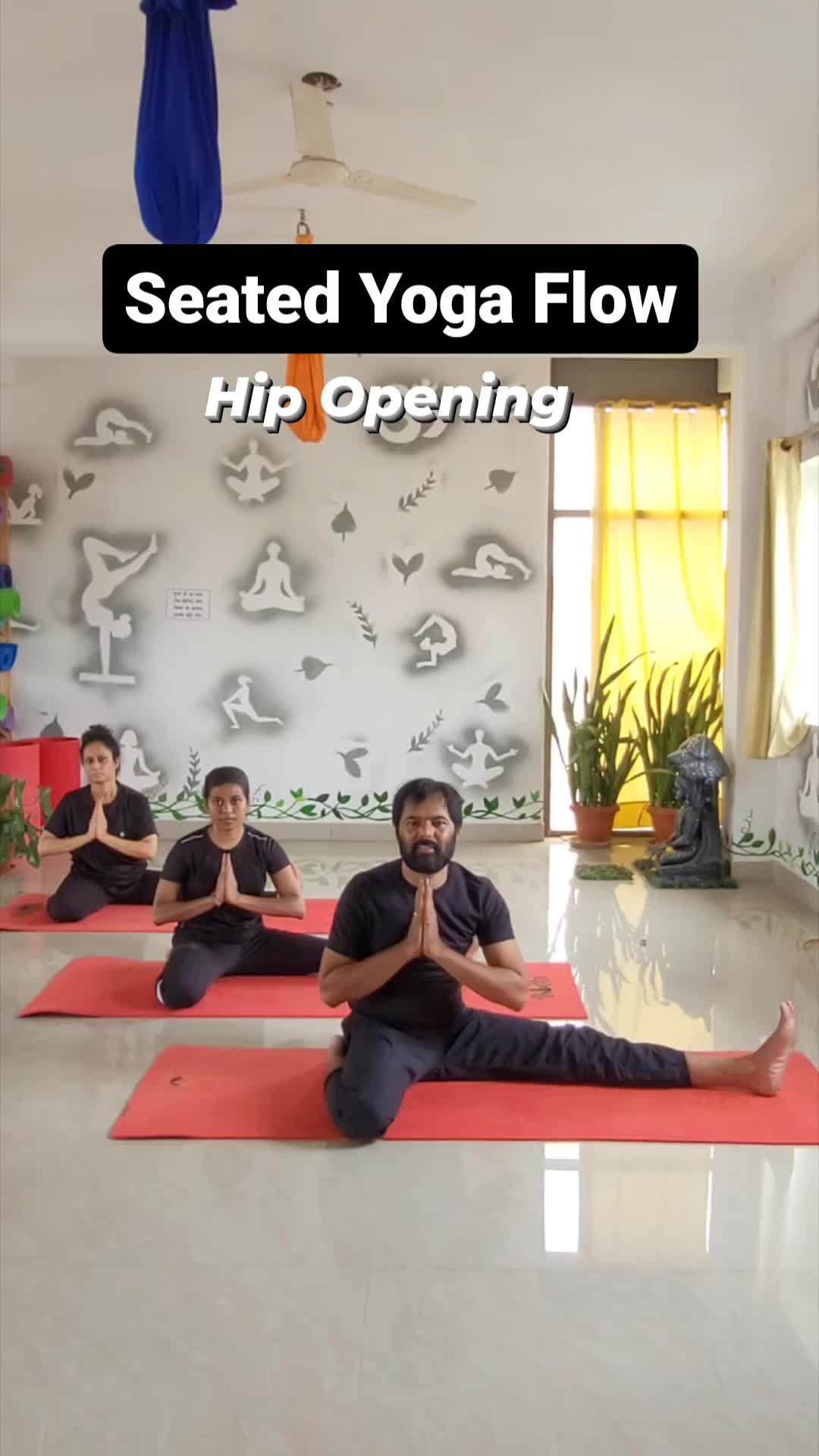 This may contain: a group of people sitting on yoga mats in a room with the words seated yoga flow