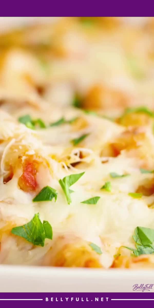 This contains: Savor the Best Baked Ziti as your main course idea! This Italian-American dish contains ground beef, marinara sauce, sour cream, and Italian seasoning. Dive into this delicious pasta casserole for a perfect pasta dinner recipe tonight!