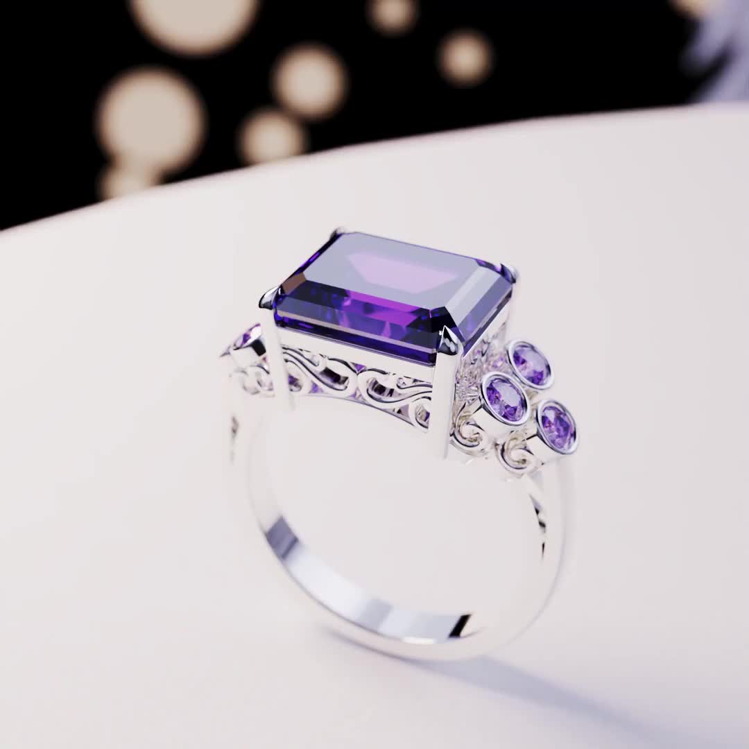 Introducing The Violet Love: This bold statement ring is perfect for any occassion. As a gift for her, a wedding ring or a gift for yourself - because you deserve it - it is guaranteed to impress. This ring is made as a 3-in-1 triple ring set. 2 perfectly fitting bands to complement the big bold center main ring. A bold and beautiful simulated amethyst sits like a crown in the center of a gemstone halo. The sides covered with beautiful simulated diamonds and purple enamel. Underneath you have pr