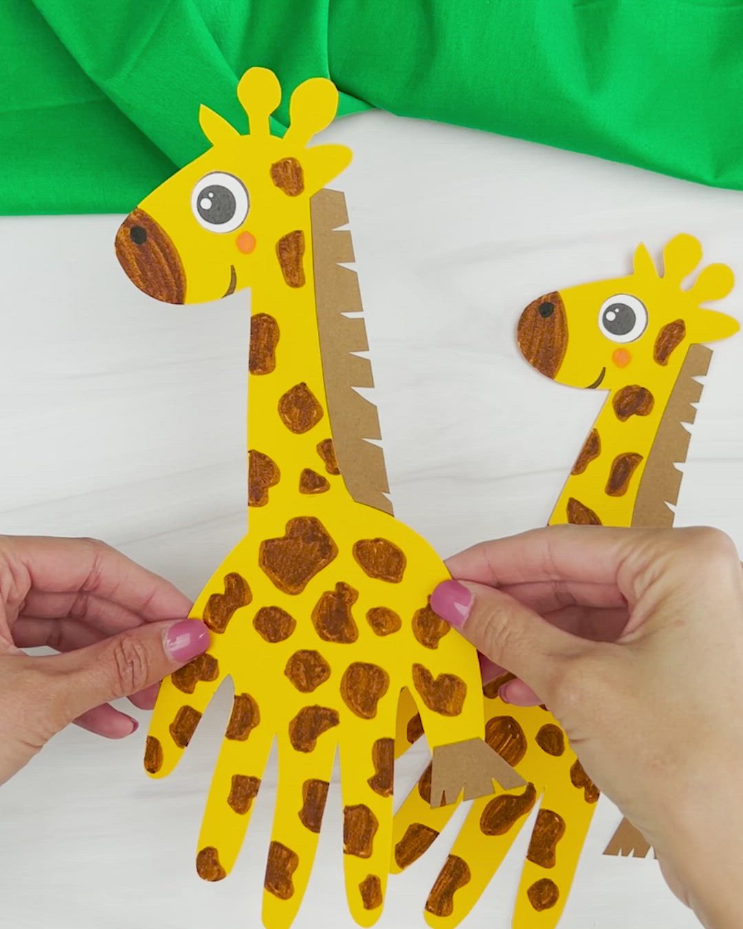 This contains an image of: Handprint Giraffe Craft For Kids