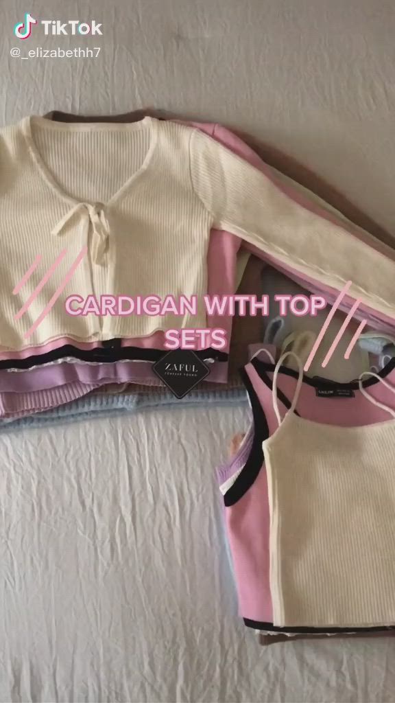 This contains an image of: Cardigan with top sets