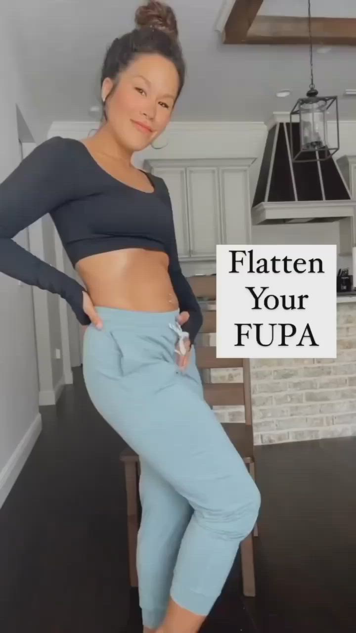 This may contain: a woman is posing for the camera with her hands on her hips and wearing cropped pants