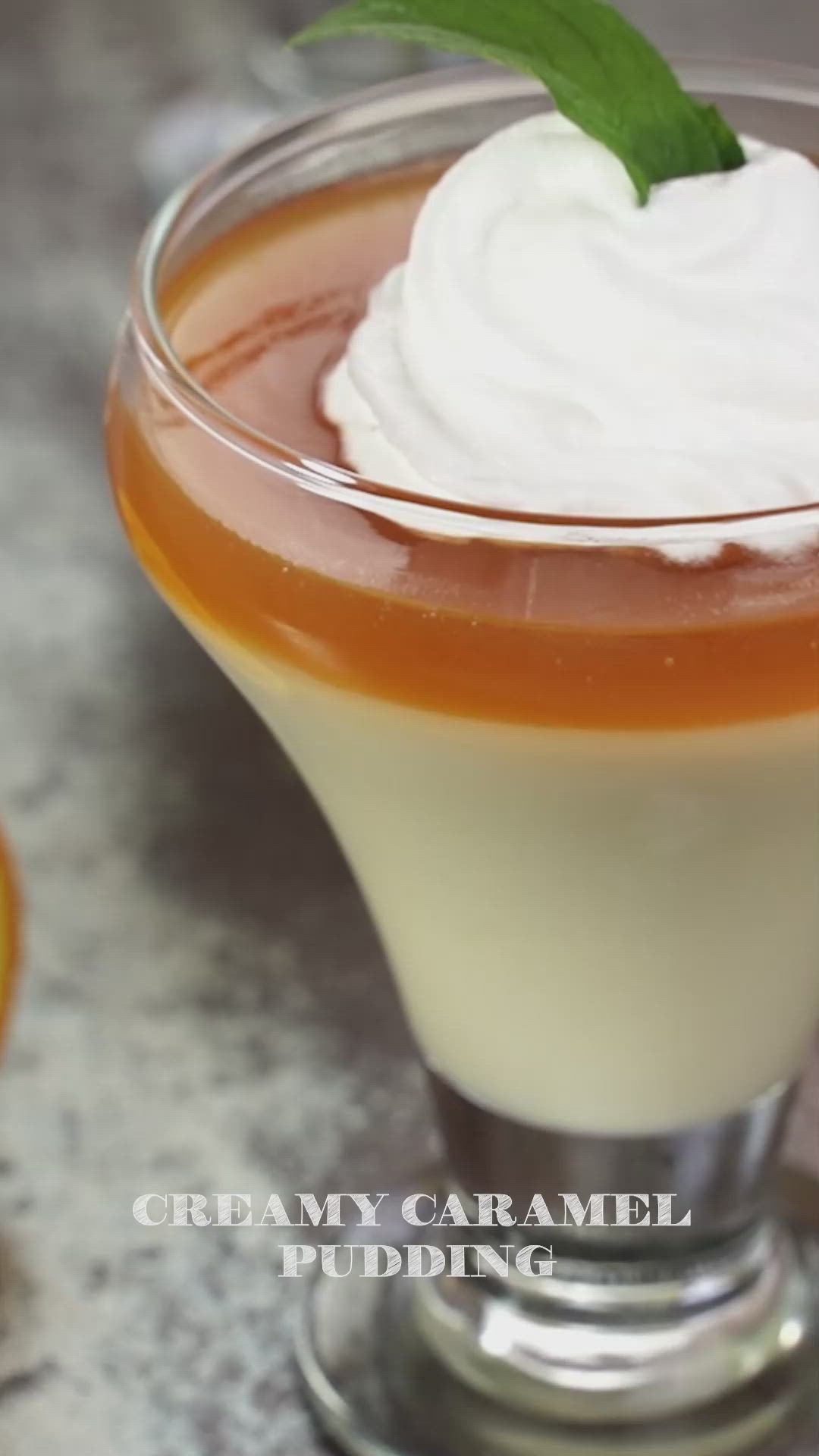 This may contain: an orange and white drink with whipped cream on top