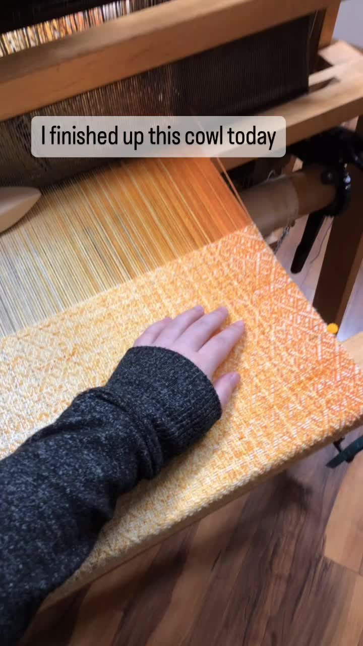 This may contain: someone is using a hand loom to weave fabric on a table top with the words, i finished up this cow today