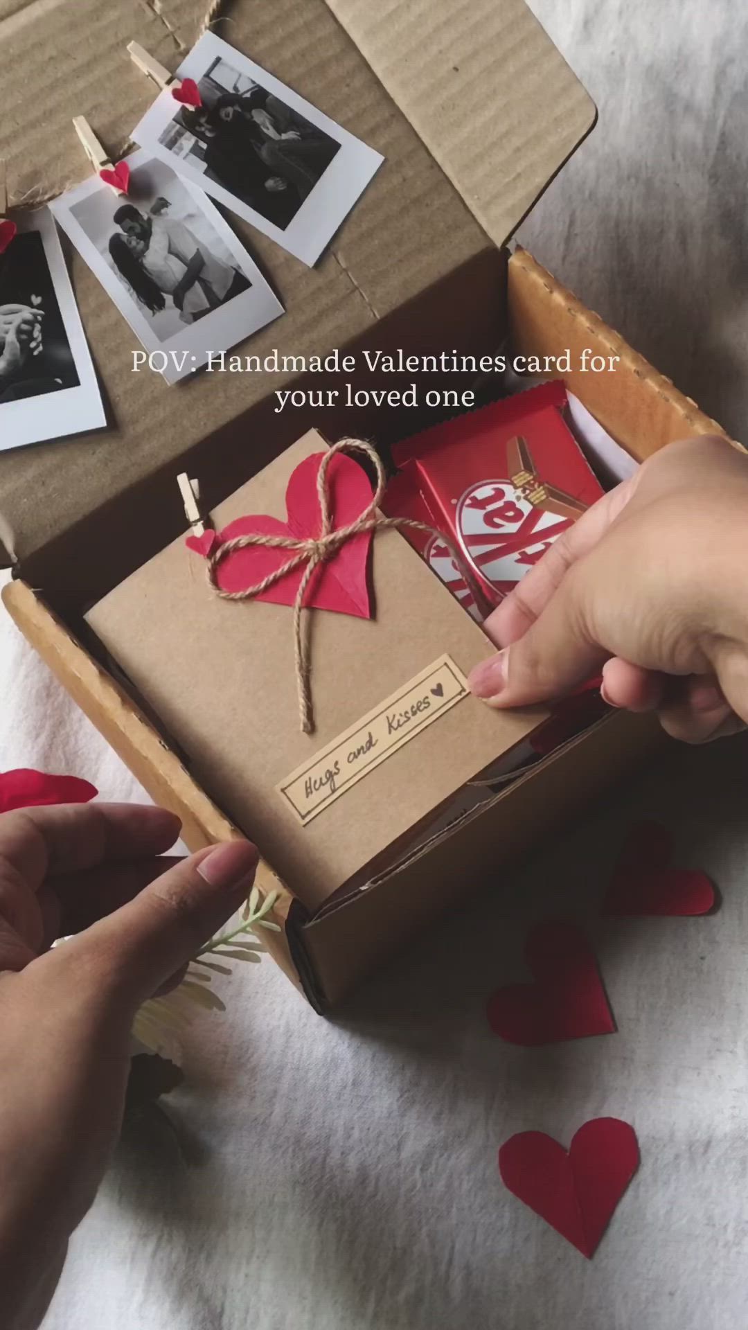 This may contain: someone is opening a valentine's card in a box