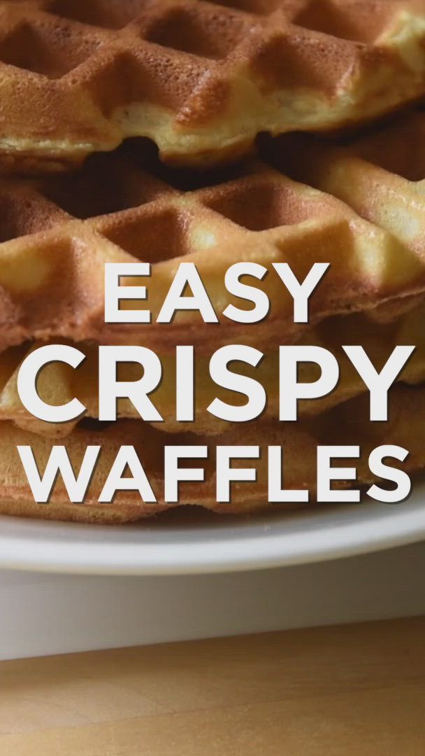 This may contain: waffles on a plate with the words easy crispy waffles