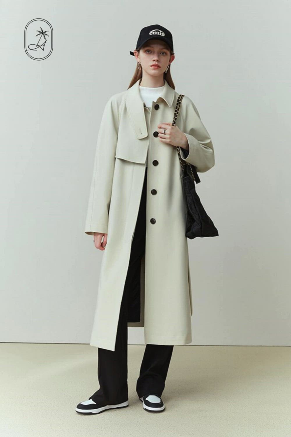 Introducing the luxe Single Breasted Ivory Trench Coat - the perfect choice for savvy fashionistas looking to make a statement. Crafted from a creamy beige fabric with black buttons and a removable belt, this timeless piece exudes sophistication and class. Add some sartorial flair to your wardrobe with this exclusive trench coat.