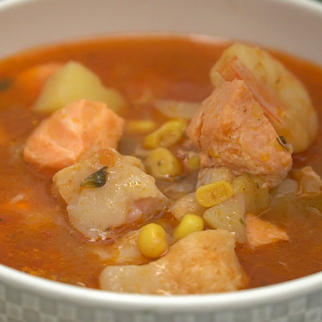 This may contain: the ultimate seafood soup recipe is ready to be eaten