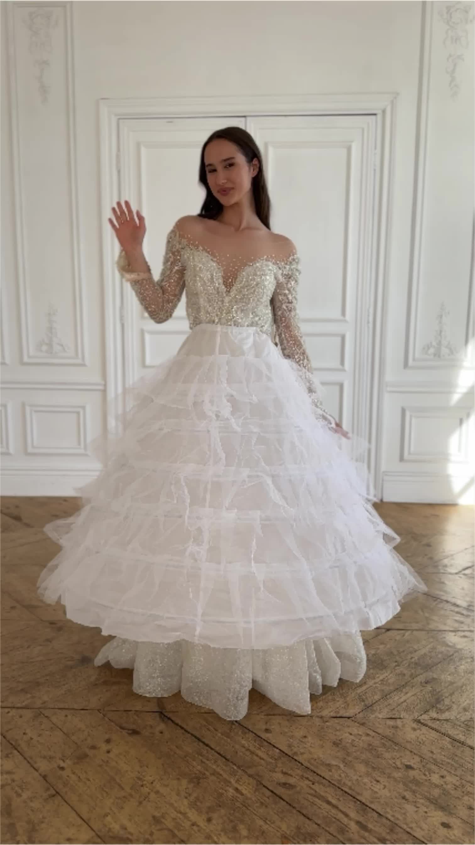 This contains: 2 in 1 sparkly glitter long sleeve handmade beaded lace corset ballgown wedding dress with removable skirt