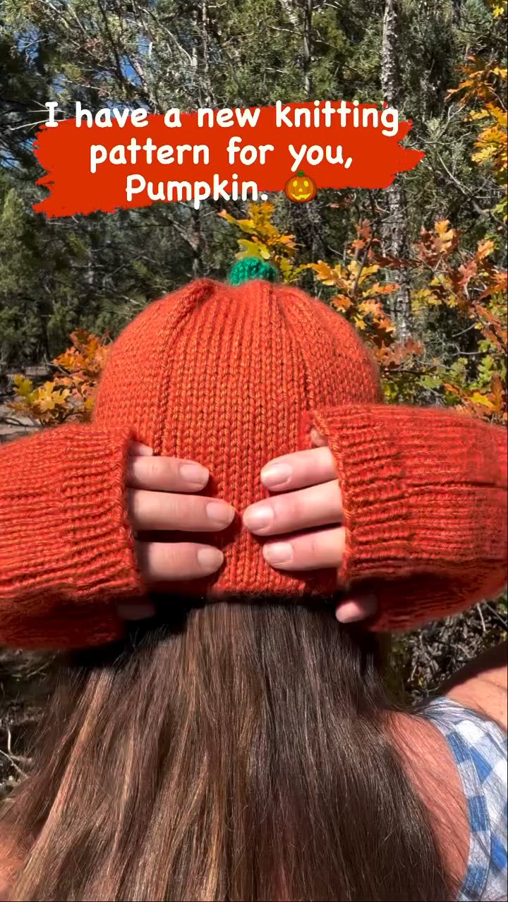 This may contain: a woman wearing an orange knitted hat with the words i have a new knitting pattern for you, pumpkin