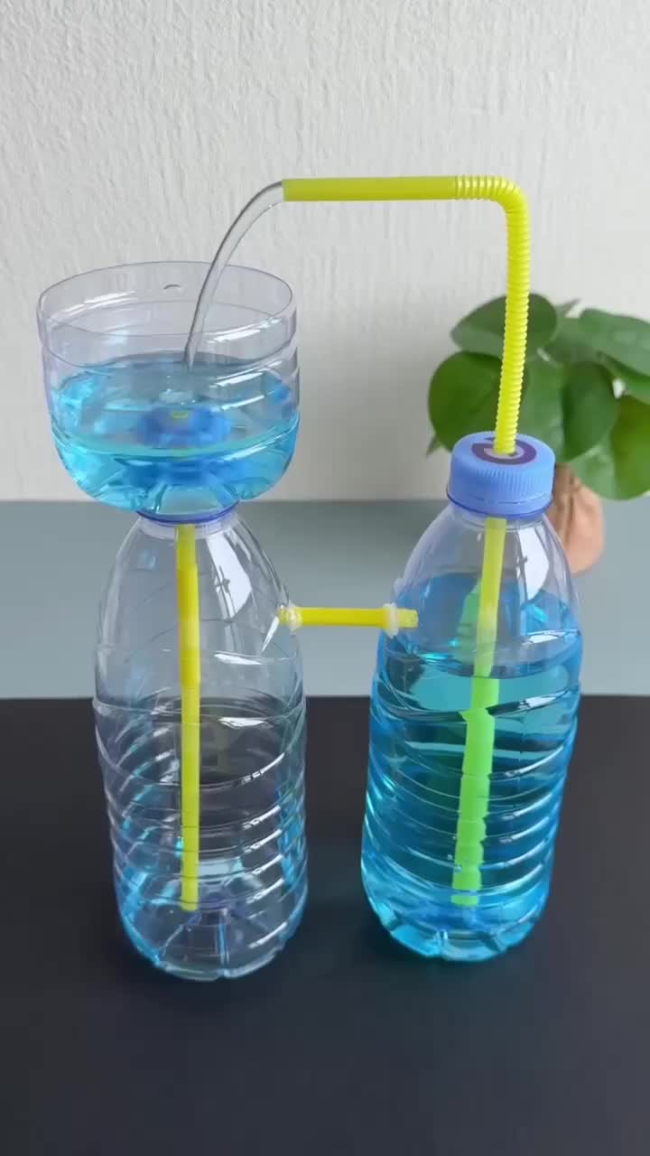 This may contain: two plastic water bottles with yellow straws and one has a blue bottle filled with water