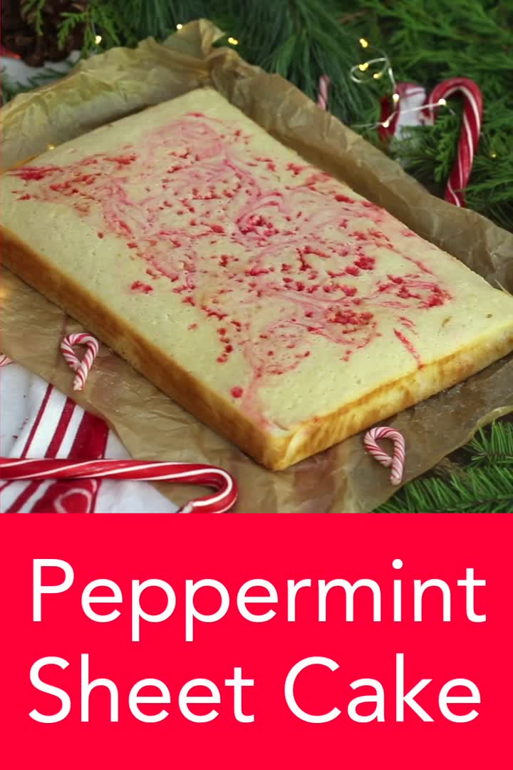 This may contain: peppermint sheet cake with white frosting and sprinkles on top