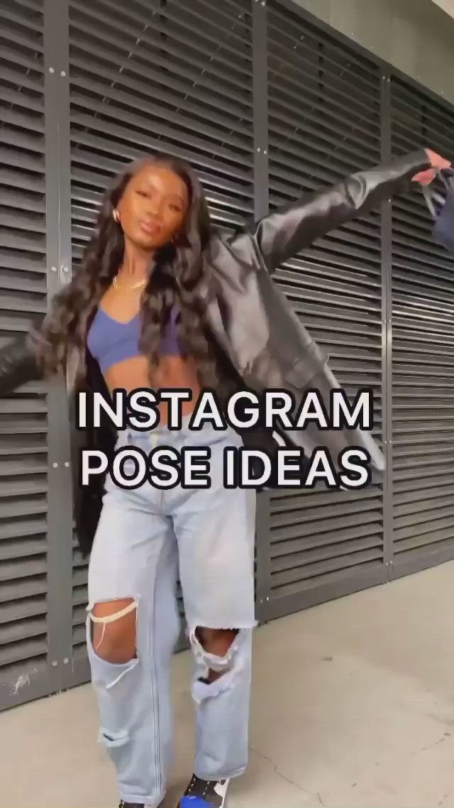 This may contain: a woman in ripped jeans standing next to a wall with the words instagramm pose ideas