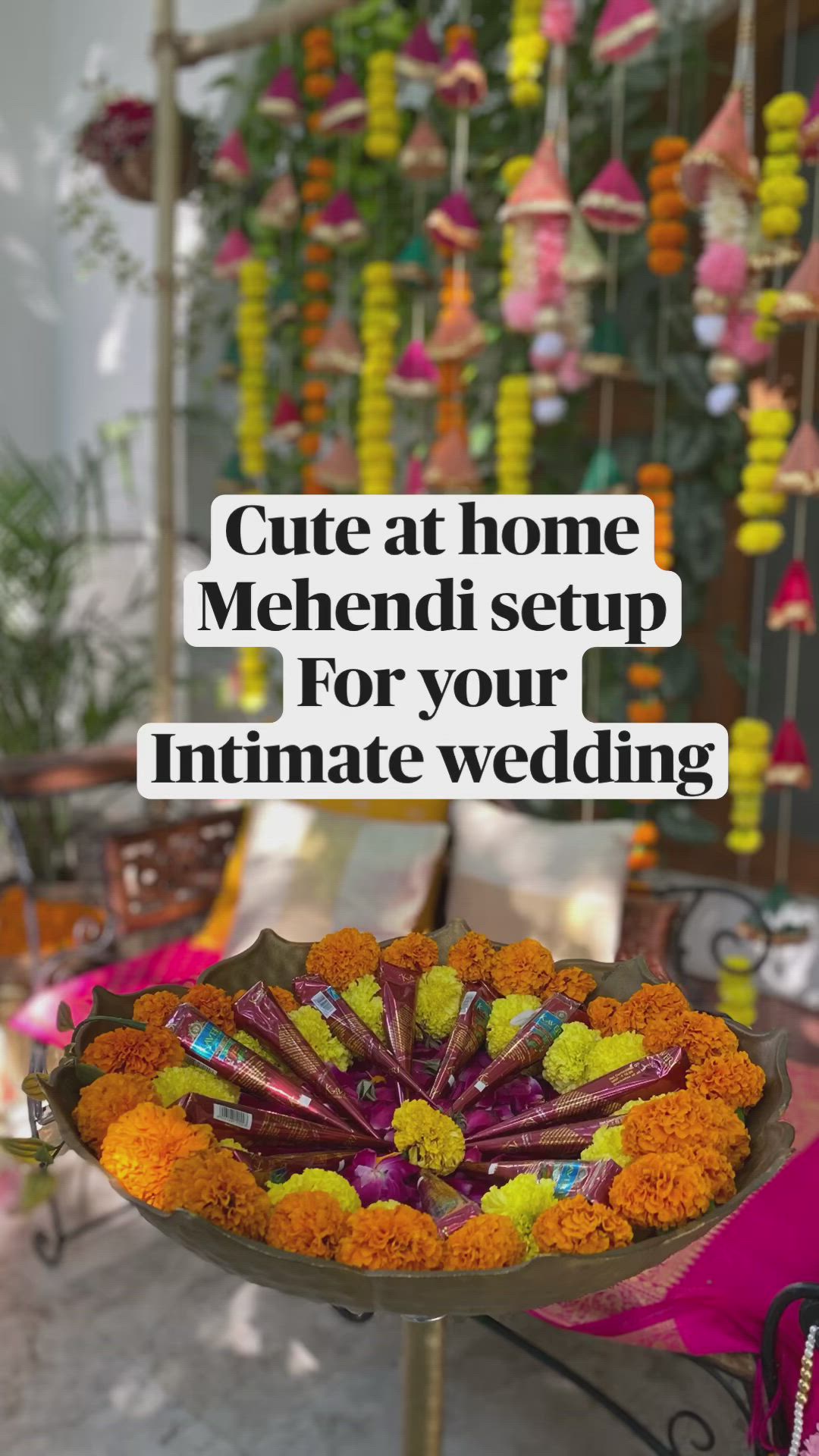 This may contain: a flower arrangement with the words cute at home mehndi setup for your intimate wedding