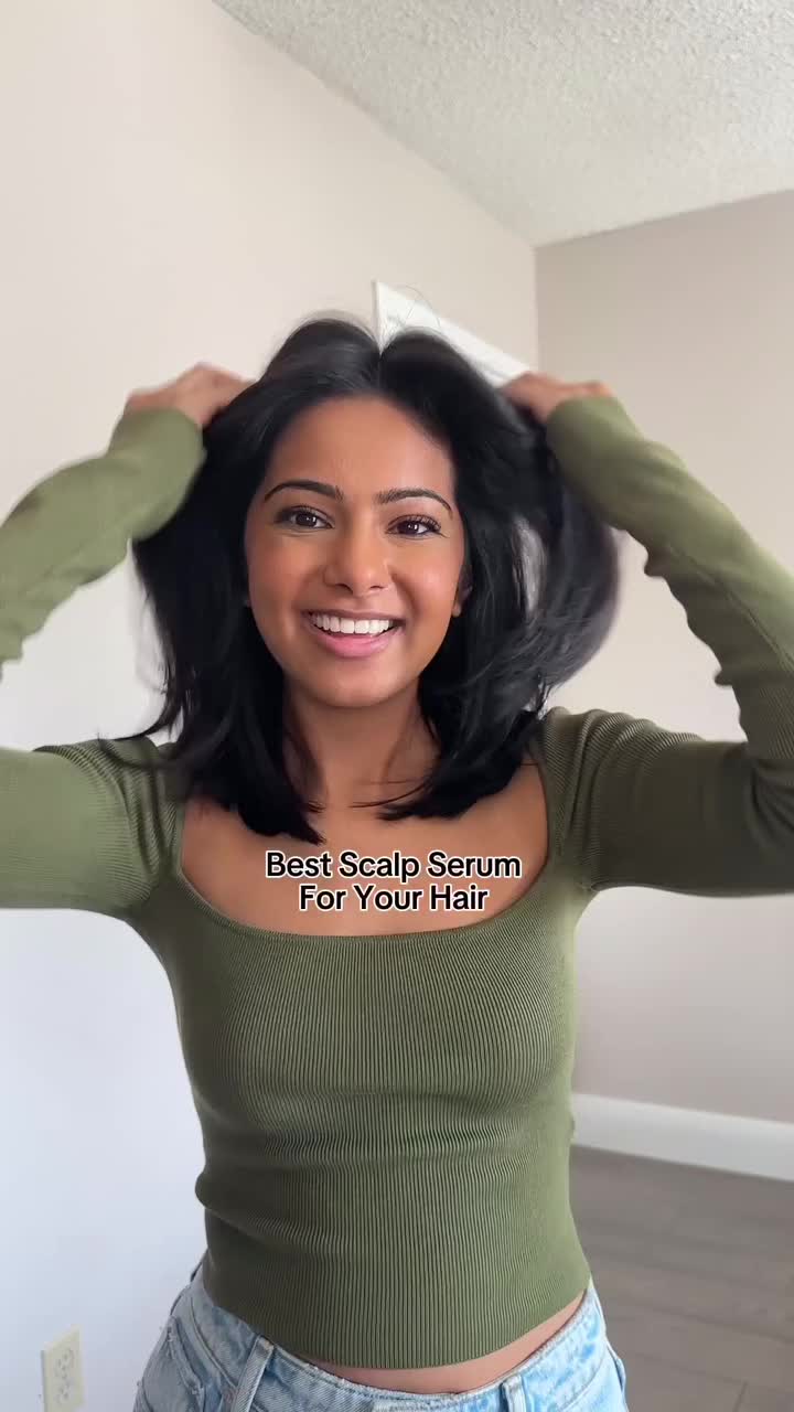 This contains: Hair dresser providing hair tutorial on using scalp serum for oily hair