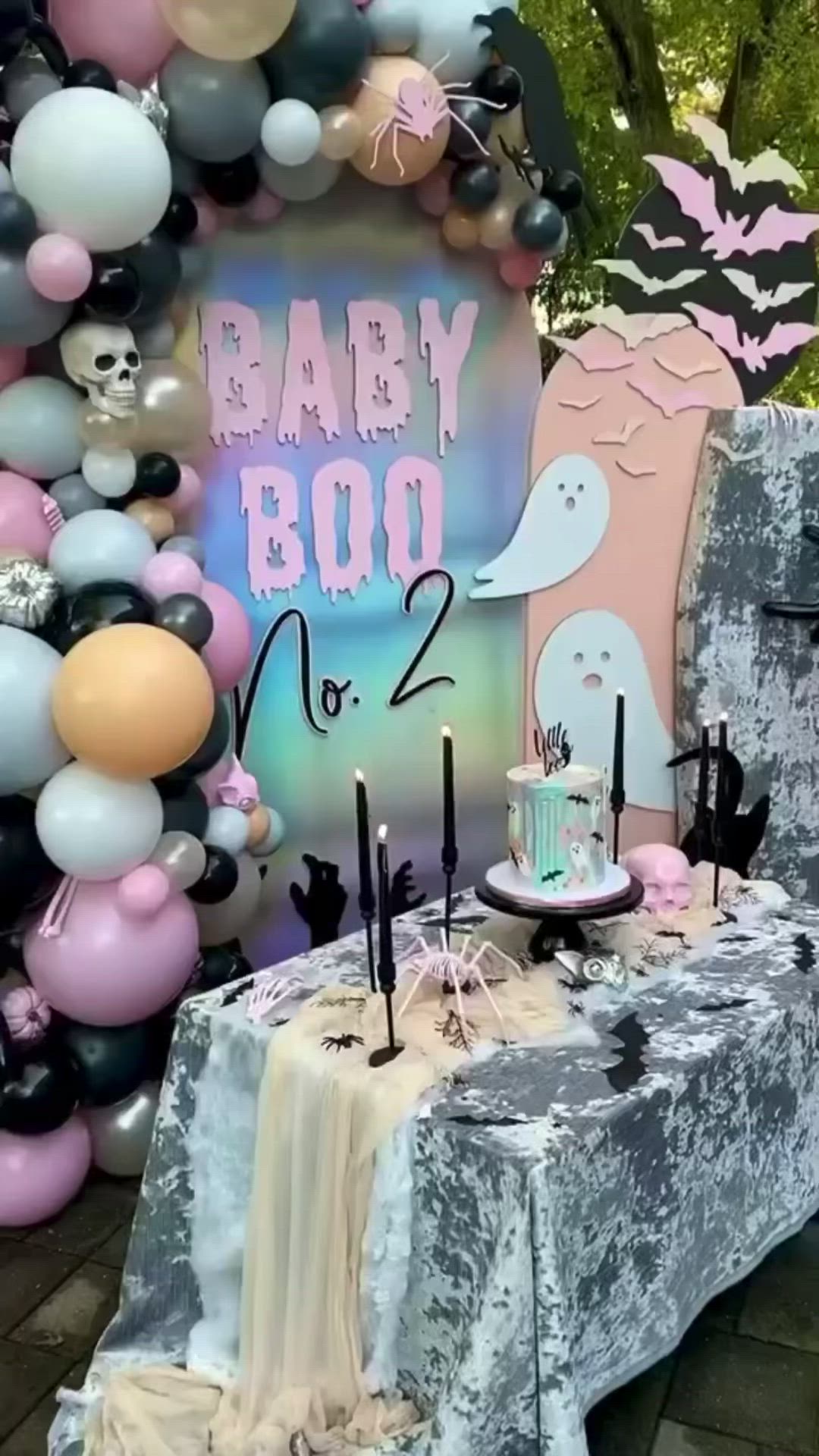 This may contain: a baby boo birthday party with balloons and decorations