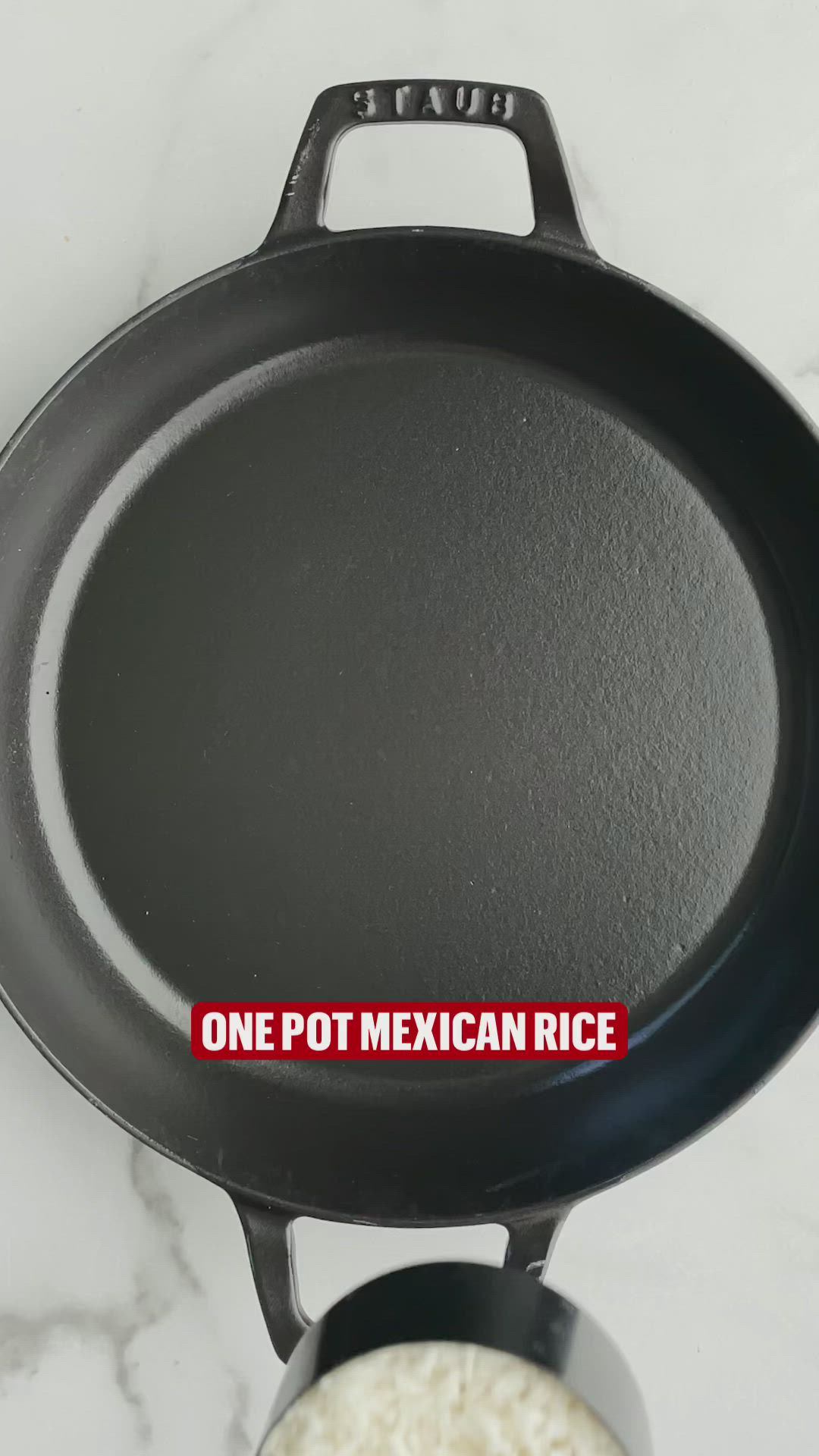 This may contain: a cast iron skillet with one pot mexican rice in the bottom right hand corner