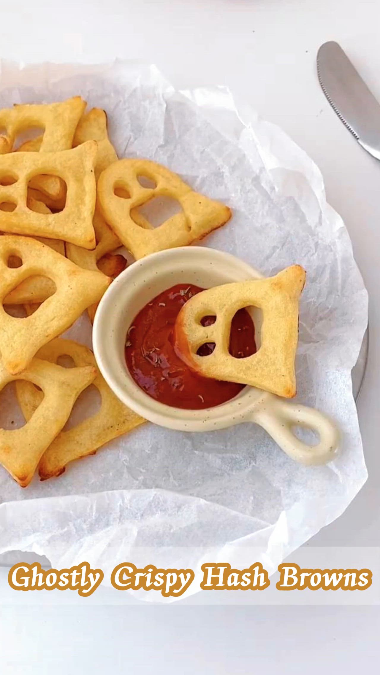 This may contain: some waffles are sitting on a plate with ketchup in a bowl