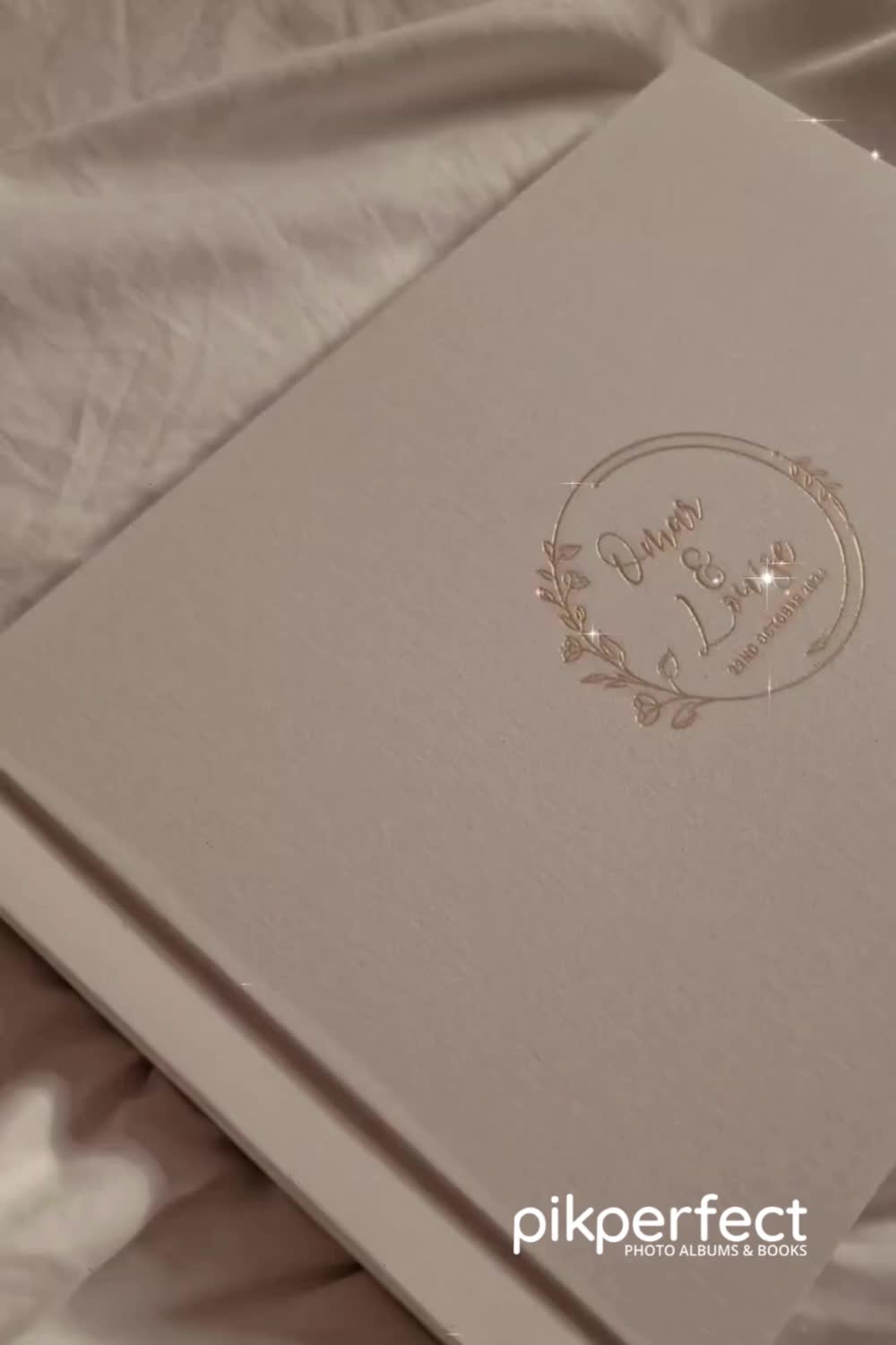 This contains: Elegant wedding photo album with a personalized cover for Omar and Louise.