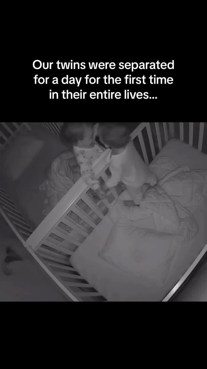 This may contain: a baby in a crib with the caption our twins were separated for a day for the first time in their entire lives