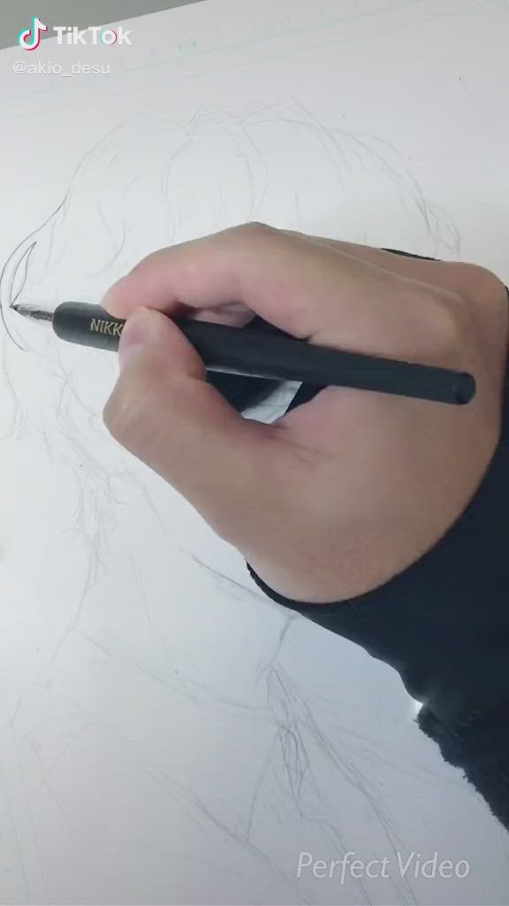 This may contain: a person is drawing with a black pen