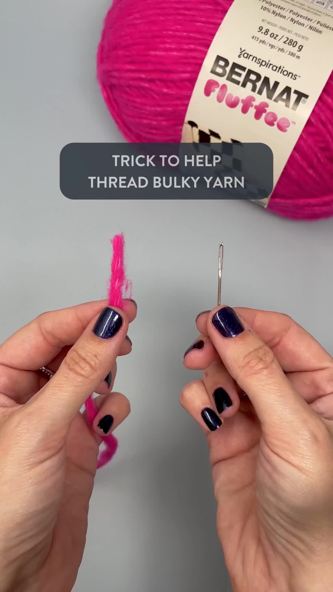 This may contain: two hands holding yarn and knitting needles with the words trick to help threaded buky yarn