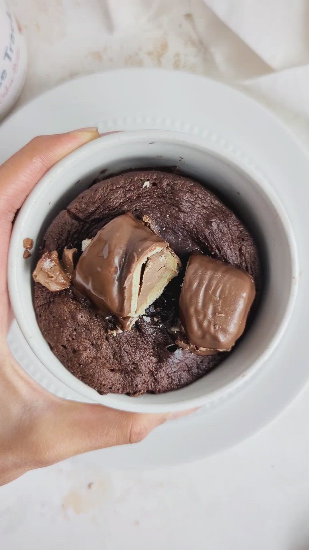 This contains: Indulgent Kinder Protein Mug Cake will be your new favorite quick dessert! With protein powder instead of sugar, a fun cashew butter and Kinder Bueno mix, this mug cake is a real treat.