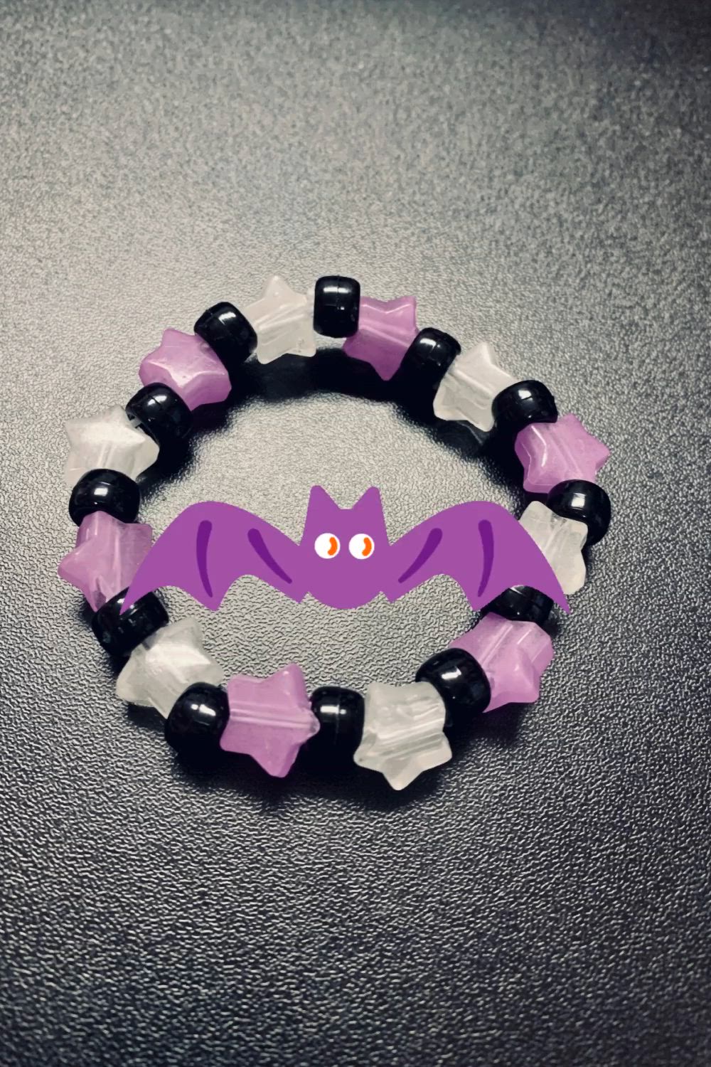 This may contain: i glow in the dark bat mag bracelet