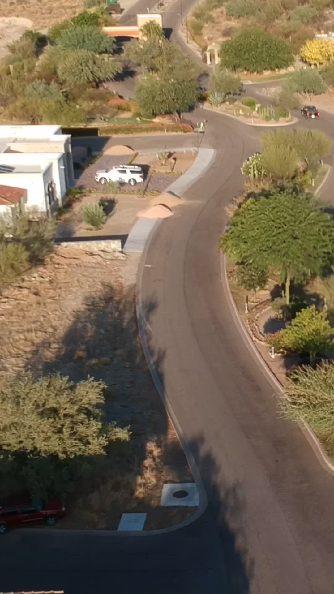 This may contain: an aerial view of a road and some buildings