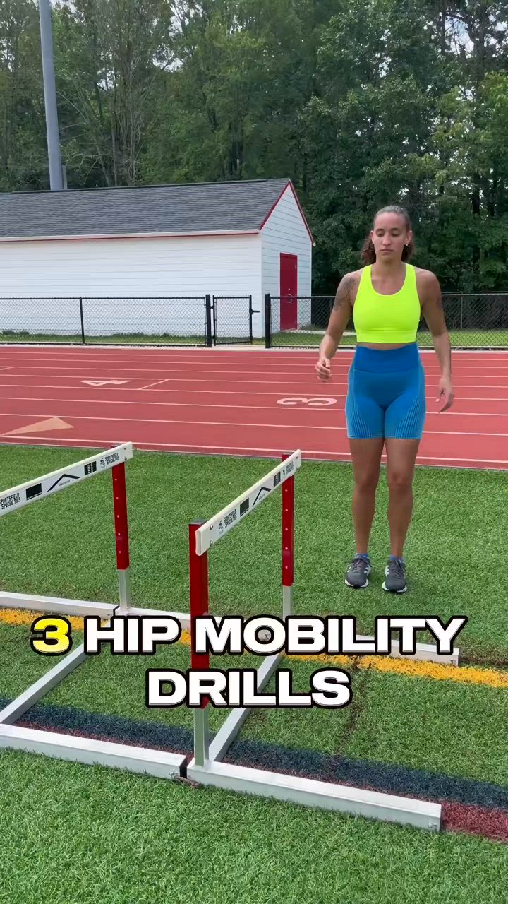 This may contain: a woman jumping over a hurdle on top of a grass covered field with the words 3 hip mobility drills