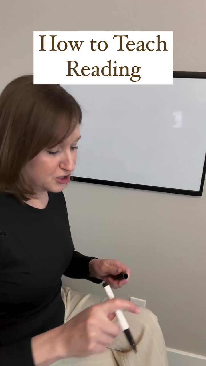 This may contain: a woman sitting in front of a white board with writing on it and the words how to teach reading