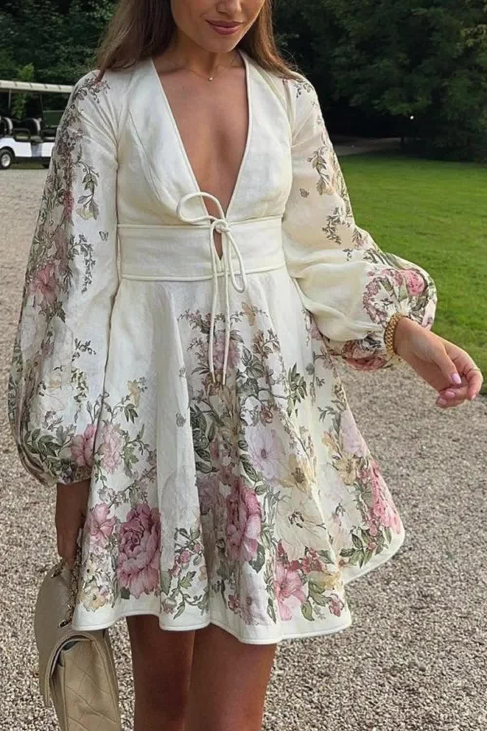 Elevate your style with the Flower Gala Linen Blend Mini Dress. Featuring a unique floral print, tie-up detailing, and balloon sleeves, this dress combines elegance with comfort. Its pocketed design adds a practical touch, making it perfect for both casual and chic outings.