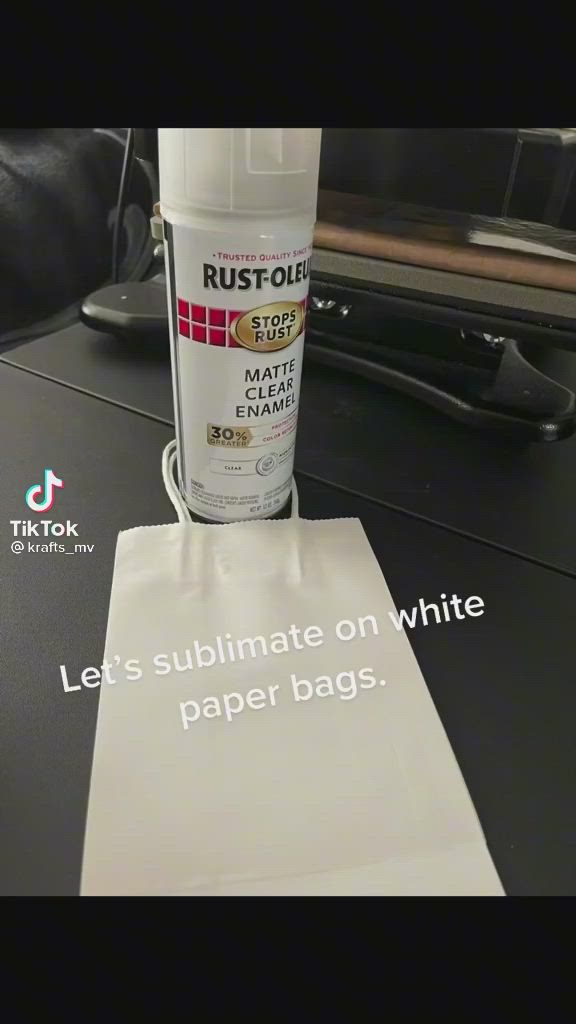 This may contain: a bottle of white paint sitting on top of a table next to a piece of paper