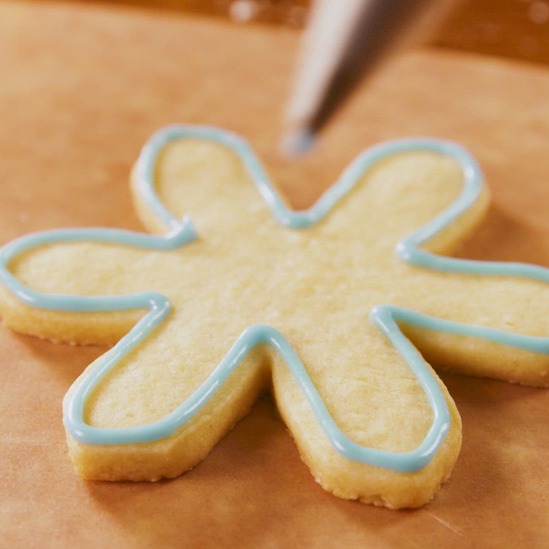 This may contain: decorated cookies are arranged on a white plate