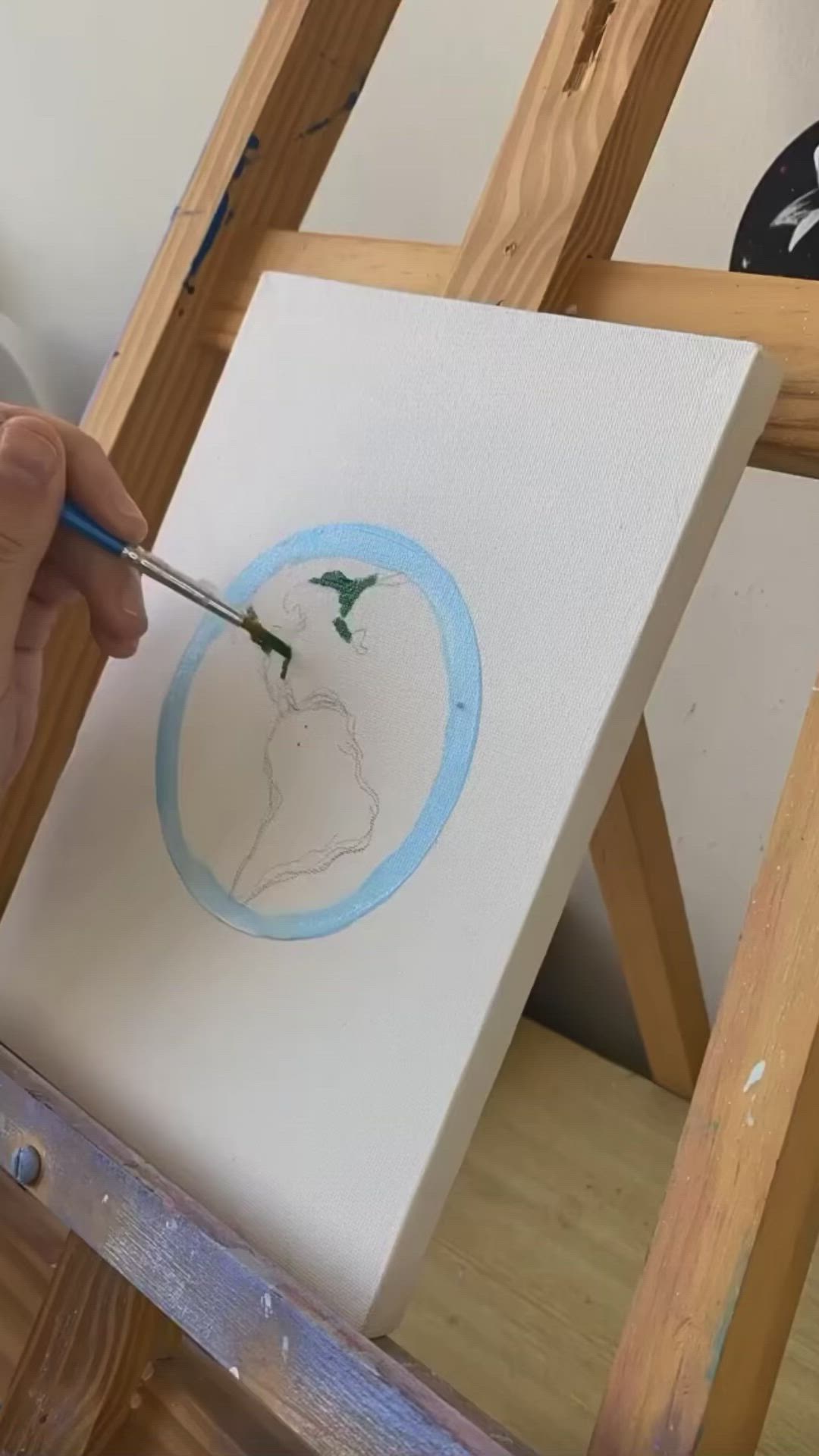 This may contain: someone is painting the earth on an easel